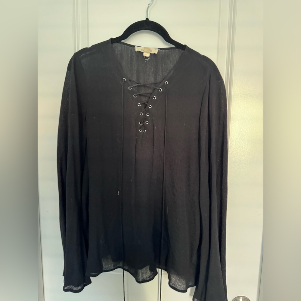Onetheland bell sleeve lace up blouse in black